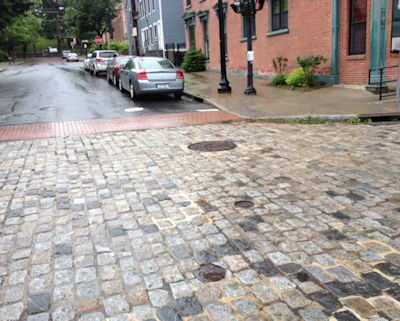 Historic district streetscape enhanced by antique cobblestone paving