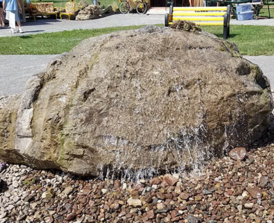 Large bubbler rock for garden or landscape focal point