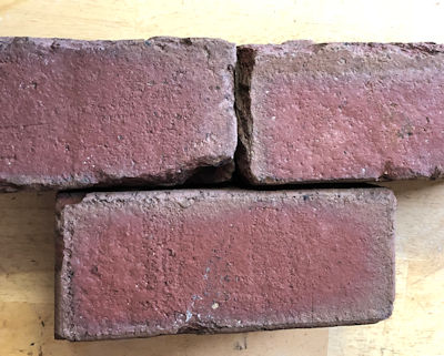 Occasionally reclaimed Metropolitan street bricks are a dark red