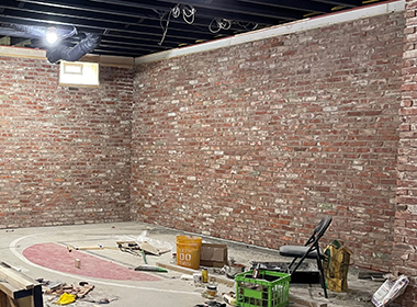 Basement refinished using our salvaged Rockpile thin brick veneer adds authentic character to the space.
